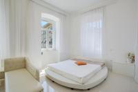 Posteľ alebo postele v izbe v ubytovaní Collins Apartments Center