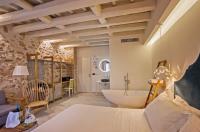 Posteľ alebo postele v izbe v ubytovaní Thalassa Boutique Hotel