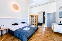 Posteľ alebo postele v izbe v ubytovaní apartamenty kamienica