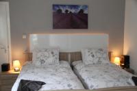a bed in a bedroom with two pillows on it at De Witte Molen Kranenburg in Kranenburg
