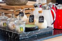 a tray with bottles of milk on a counter at Radisson Blu Hotel N'Djamena in NʼDjamena
