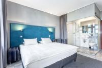 Łóżko lub łóżka w pokoju w obiekcie Hotel Kaliski