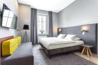 Łóżko lub łóżka w pokoju w obiekcie Hotel Kaliski