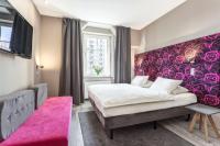 Łóżko lub łóżka w pokoju w obiekcie Hotel Kaliski