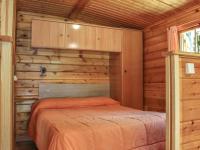 Postel nebo postele na pokoji v ubytování Cabañas de Madera Sanabria