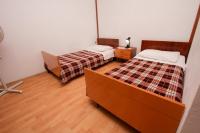 Postel nebo postele na pokoji v ubytování Apartments Stanko
