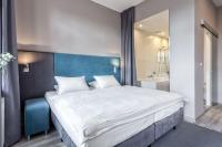 Łóżko lub łóżka w pokoju w obiekcie Hotel Kaliski