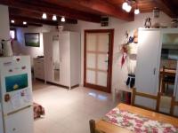A kitchen or kitchenette at Pécsely apartman