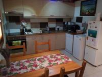 A kitchen or kitchenette at Pécsely apartman