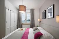 Posteľ alebo postele v izbe v ubytovaní Apartment Rabac 19