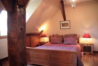 Tempat tidur dalam kamar di Chambres d&#39;h&ocirc;tes Les Charmettes