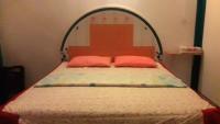 Postel nebo postele na pokoji v ubytování Jidapha Rooms