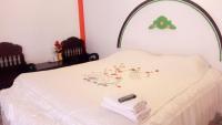 Postel nebo postele na pokoji v ubytování Jidapha Rooms