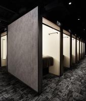 a row of windows in a room with a bed at The Millennials Kyoto in Kyoto
