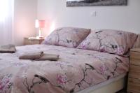 Posteľ alebo postele v izbe v ubytovaní Apartmani Lavanda