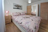 Posteľ alebo postele v izbe v ubytovaní Apartmani Lavanda