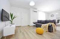 Televízia a/alebo spoločenská miestnosť v ubytovaní Apartmani Lavanda