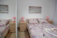 Posteľ alebo postele v izbe v ubytovaní Apartmani Lavanda