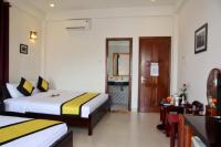 Quynh Chau Homestay Hội Anにあるベッド