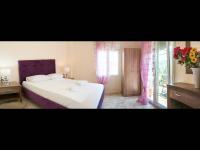 A bed or beds in a room at Namare Luxury Apartments