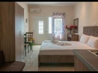 A bed or beds in a room at Namare Luxury Apartments