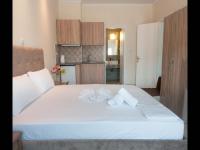 A bed or beds in a room at Namare Luxury Apartments