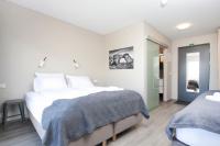 Postel nebo postele na pokoji v ubytování Arnarstapi Hotel