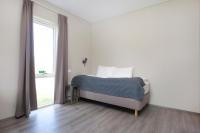 Postel nebo postele na pokoji v ubytování Arnarstapi Hotel