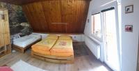 A bed or beds in a room at Chata Lucia