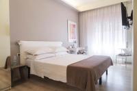 A bed or beds in a room at Residenza Talenti Superior Rooms