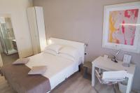 A bed or beds in a room at Residenza Talenti Superior Rooms