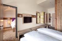 Posteľ alebo postele v izbe v ubytovaní Explorer Hotel Zillertal