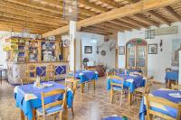 a dining room with blue tables and chairs at Hotel Posada Casas Viejas in Benalup Casas Viejas