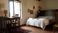 A bed or beds in a room at Casina in pietra