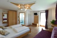 Łóżko lub łóżka w pokoju w obiekcie Agritur Maso Chemela