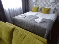 Posteľ alebo postele v izbe v ubytovaní Carina Hotel