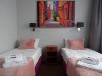 Posteľ alebo postele v izbe v ubytovaní Carina Hotel