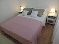Posteľ alebo postele v izbe v ubytovaní Apartman s pogledom
