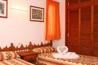 Posteľ alebo postele v izbe v ubytovaní Apartamentos del Rey