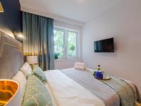 Posteľ alebo postele v izbe v ubytovaní Apartament DWIE SOSNY