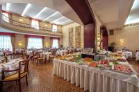 a banquet hall with tables with food on them at Hotel Terme Salus in Abano Terme