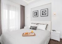 Posteľ alebo postele v izbe v ubytovaní Landmark Apartments