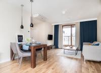 Televízia a/alebo spoločenská miestnosť v ubytovaní Landmark Apartments