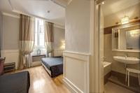 Posteľ alebo postele v izbe v ubytovaní 939 Hotel