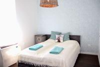 a bedroom with a bed with two towels on it at Vánkos in Badacsonyörs