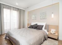 Posteľ alebo postele v izbe v ubytovaní Landmark Apartments