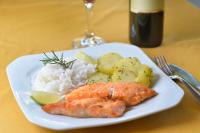 a plate of food with fish rice and vegetables at Tri Hotel Executive Caxias in Caxias do Sul