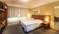 Tri Hotel Executive Caxiasにあるベッド