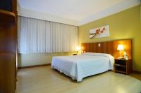 Tri Hotel Executive Caxiasにあるベッド