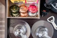 a drawer with a cup and two glasses at The Chamberlain in London